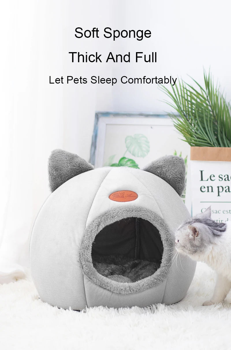 Transform your cat’s rest with a cozy, warm, and safe cat house. The semi‑closed design in a cute cat‑head shape provides comfort, protection, and non‑slip stability — perfect for all seasons. The ideal bed for cats who love to feel cared for.