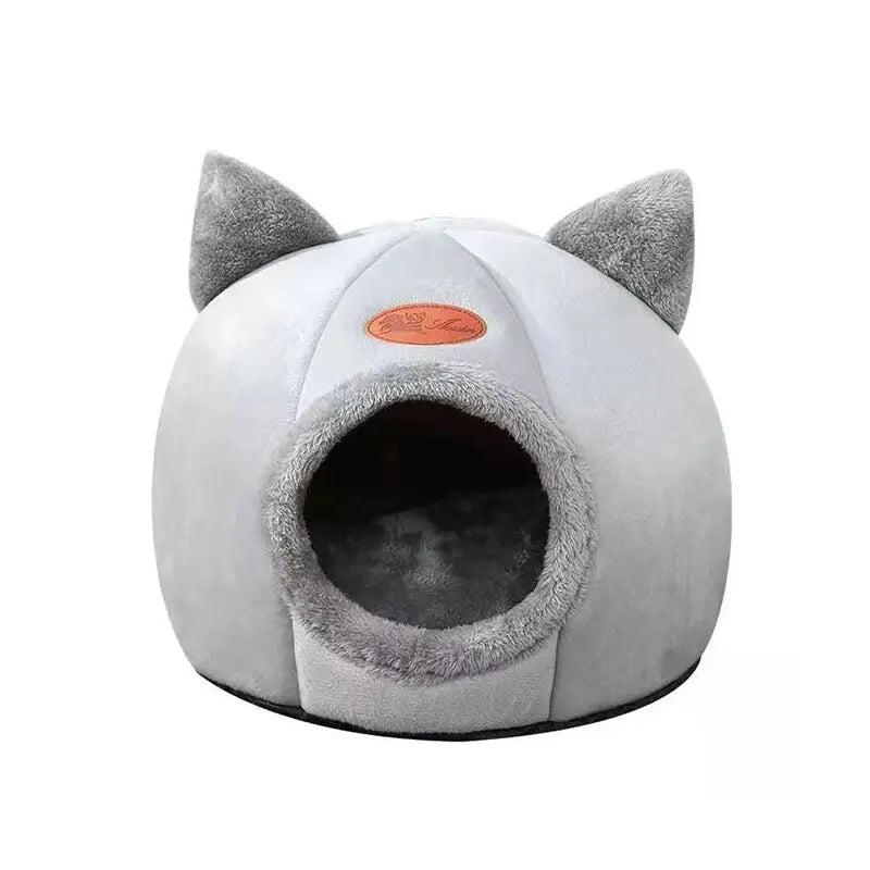 Transform your cat’s rest with a cozy, warm, and safe cat house. The semi‑closed design in a cute cat‑head shape provides comfort, protection, and non‑slip stability — perfect for all seasons. The ideal bed for cats who love to feel cared for.