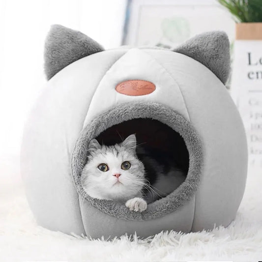 Transform your cat’s rest with a cozy, warm, and safe cat house. The semi‑closed design in a cute cat‑head shape provides comfort, protection, and non‑slip stability — perfect for all seasons. The ideal bed for cats who love to feel cared for.