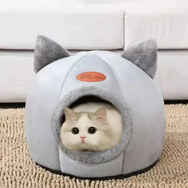 Transform your cat’s rest with a cozy, warm, and safe cat house. The semi‑closed design in a cute cat‑head shape provides comfort, protection, and non‑slip stability — perfect for all seasons. The ideal bed for cats who love to feel cared for.